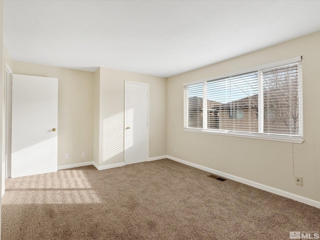 view of carpeted spare room