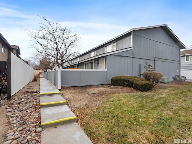 view of side of property with a yard