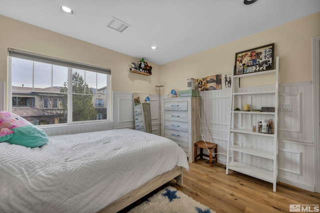 bedroom with light hardwood / wood-style floors