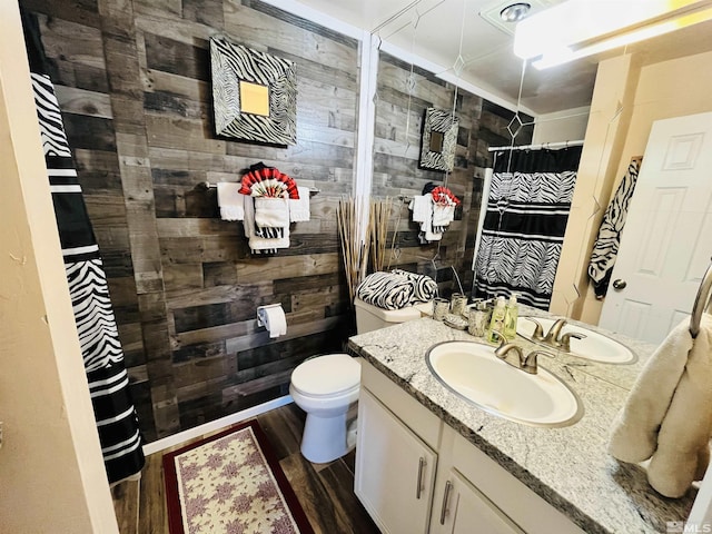 bathroom featuring walk in shower, vanity, wooden walls, hardwood / wood-style floors, and toilet