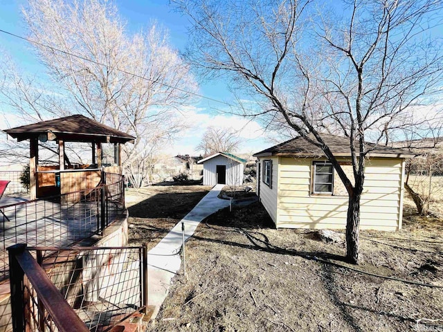 view of side of home with an outdoor structure