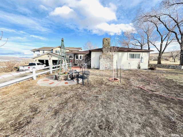 back of house featuring a patio