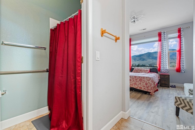 bathroom with wood-type flooring