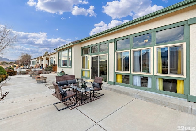 view of patio / terrace with an outdoor fire pit