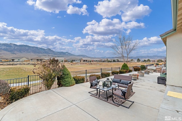 view of patio featuring a mountain view and an outdoor hangout area