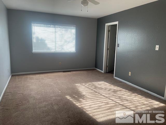 carpeted empty room with ceiling fan