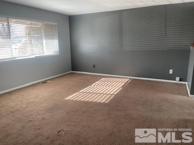 empty room featuring carpet flooring