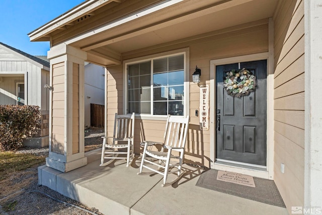 property entrance with covered porch