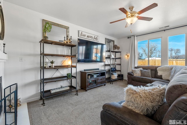 living room with carpet floors and ceiling fan