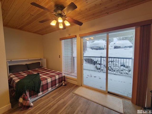 bedroom with access to outside, ceiling fan, light hardwood / wood-style floors, and wood ceiling