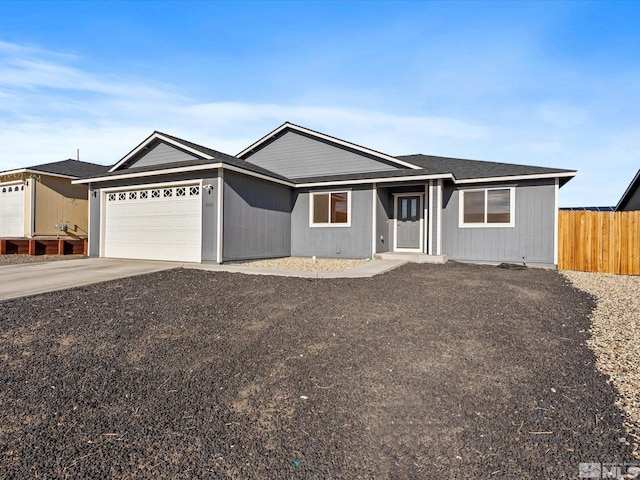 ranch-style house featuring a garage