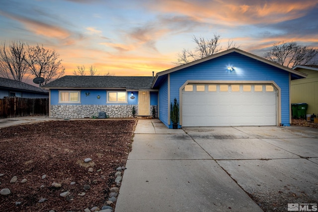 single story home with a garage