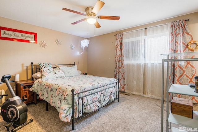 bedroom featuring ceiling fan and carpet floors