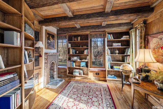 sitting room featuring beam ceiling, wood ceiling, and hardwood / wood-style floors