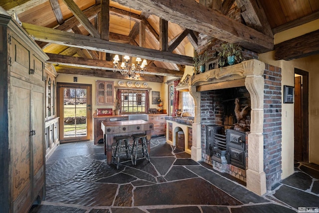 interior space featuring beam ceiling, high vaulted ceiling, and wooden ceiling