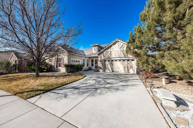 view of front of property featuring a front yard and a garage