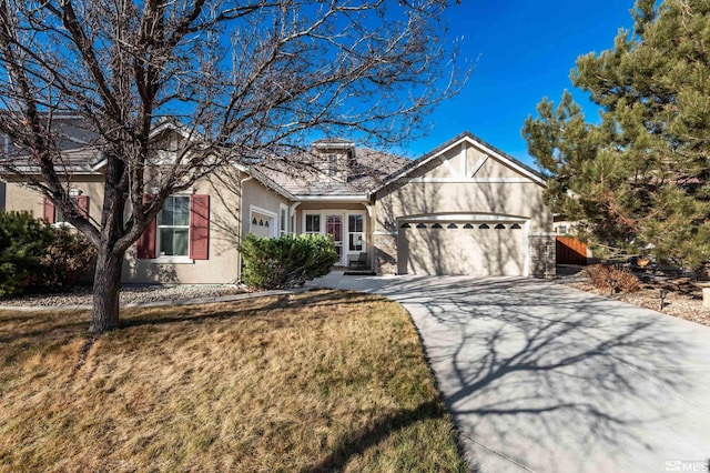 view of front of property with a garage and a front yard