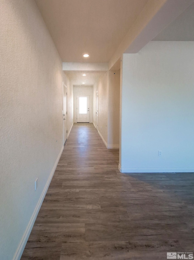 hall with dark wood-type flooring