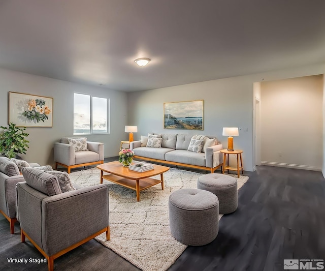 living room featuring dark wood-type flooring