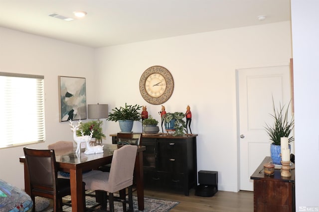 dining area with dark wood-type flooring