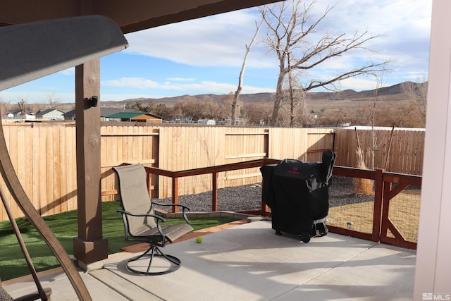 exterior space with grilling area and a mountain view