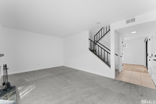 unfurnished living room with light tile patterned floors