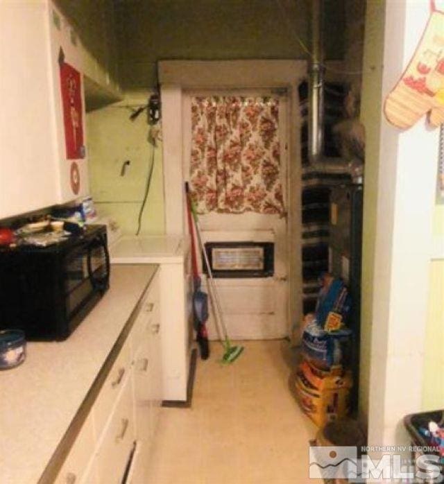 kitchen featuring white cabinets