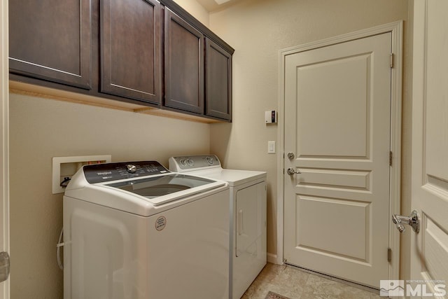 washroom with cabinets and separate washer and dryer