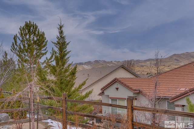 view of side of property with a mountain view