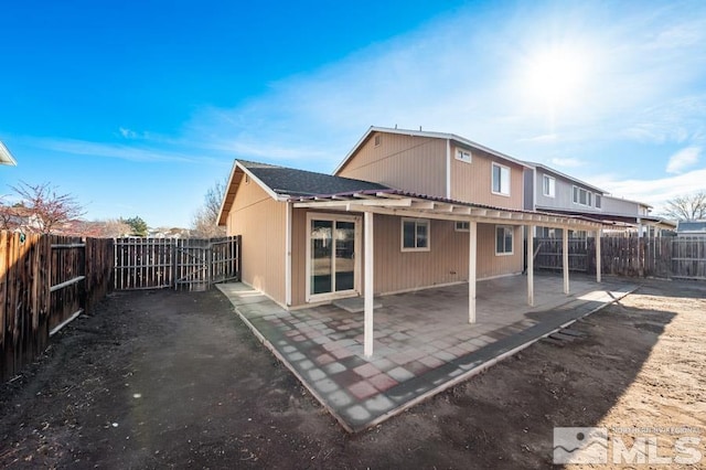 rear view of house with a patio