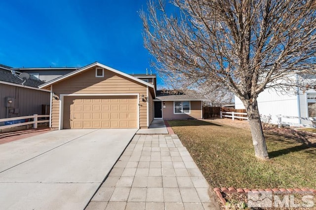 view of front facade featuring a garage and a front yard