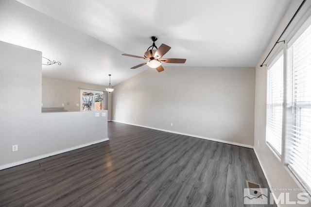 interior space featuring dark hardwood / wood-style floors, vaulted ceiling, and plenty of natural light