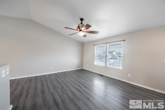 unfurnished room featuring ceiling fan, lofted ceiling, and dark wood-type flooring