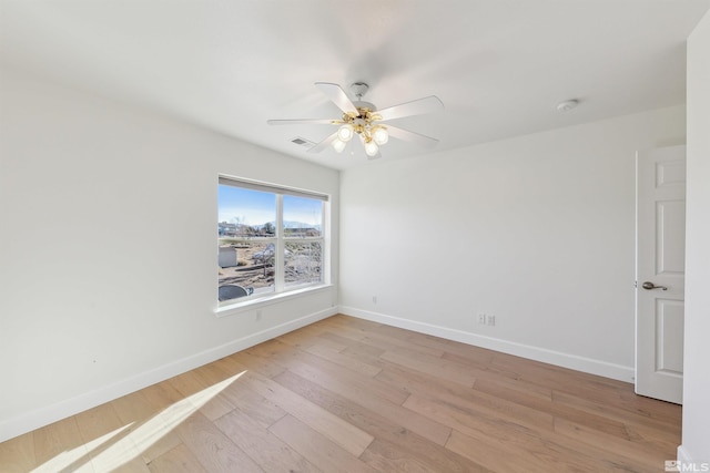 spare room with ceiling fan and light hardwood / wood-style floors