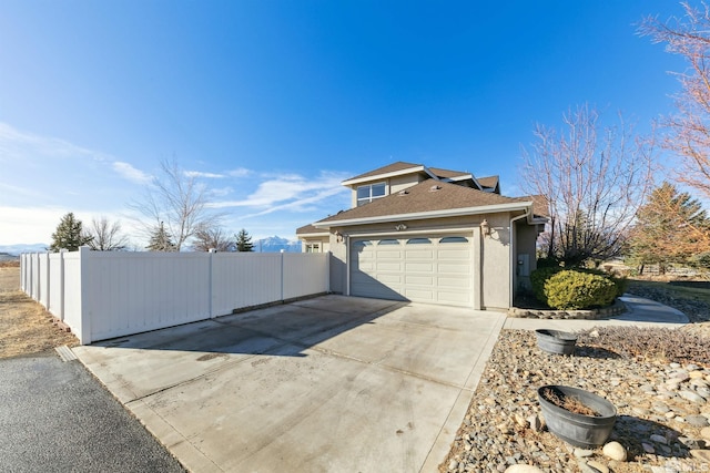 view of side of property featuring a garage