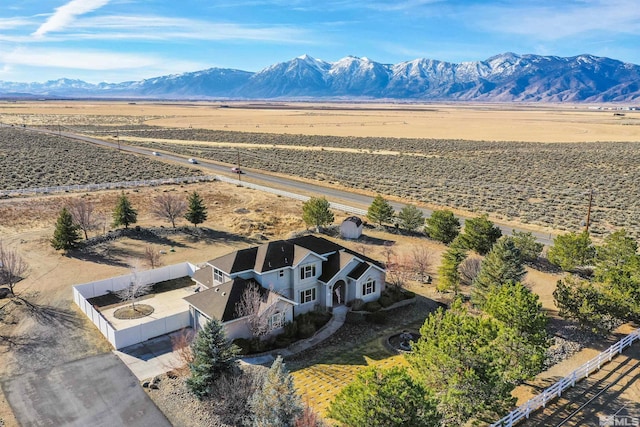 drone / aerial view with a mountain view and a rural view