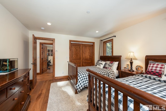 bedroom featuring light wood-type flooring