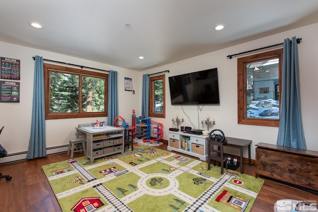 playroom with dark hardwood / wood-style floors