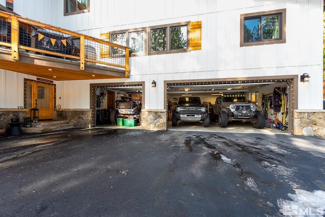 garage featuring wooden walls