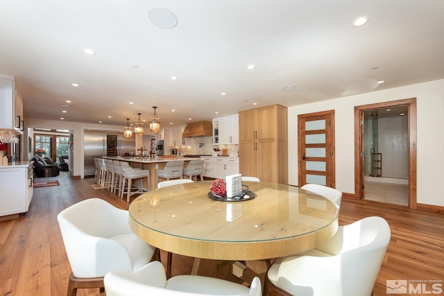 dining area with light wood-type flooring