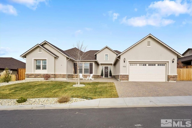 view of front of property with a front lawn and a garage