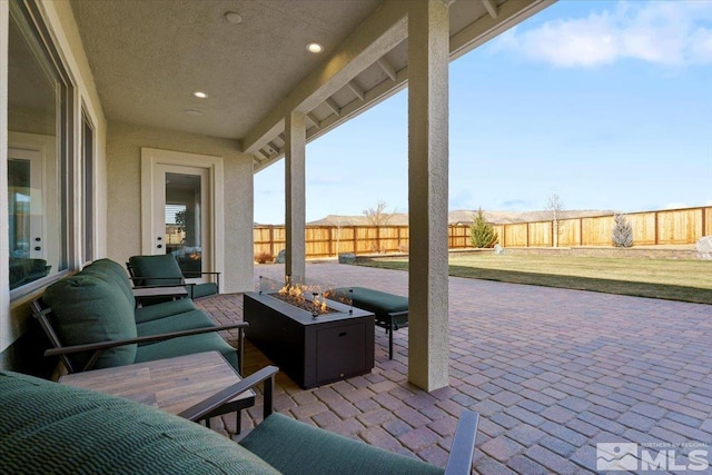 view of patio featuring an outdoor fire pit