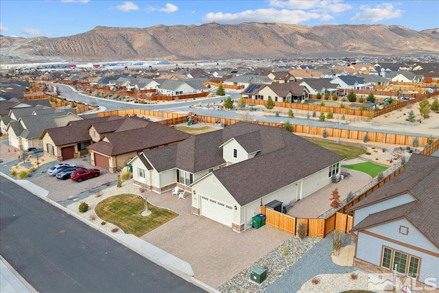 birds eye view of property with a mountain view