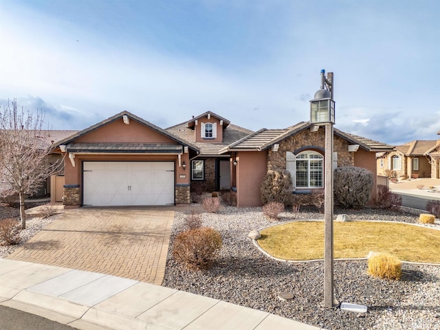 ranch-style house featuring a garage