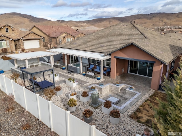 birds eye view of property featuring a mountain view