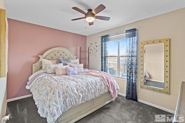 bedroom featuring dark carpet and ceiling fan