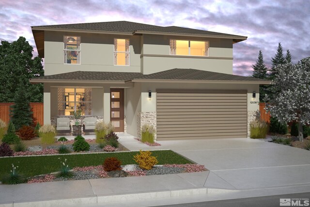 view of front facade featuring covered porch and a garage