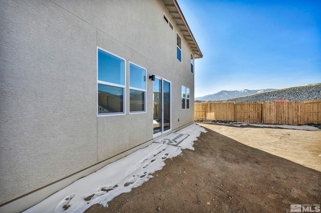 view of side of home featuring a mountain view