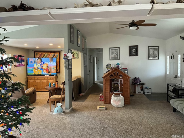 carpeted living room featuring ceiling fan and lofted ceiling