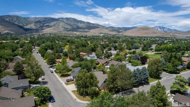 birds eye view of property with a mountain view